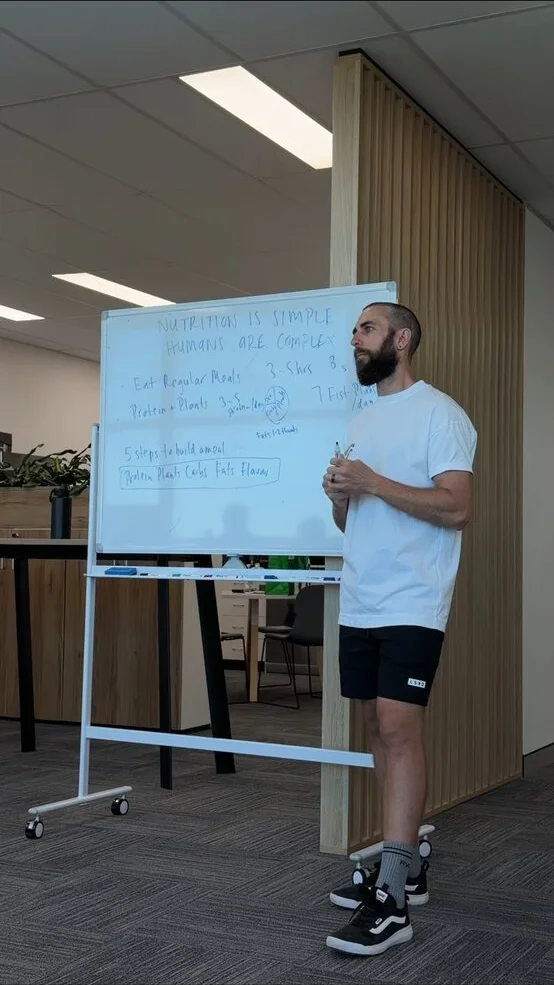 Josh giving a talk — nutrition is simple, humans are complex